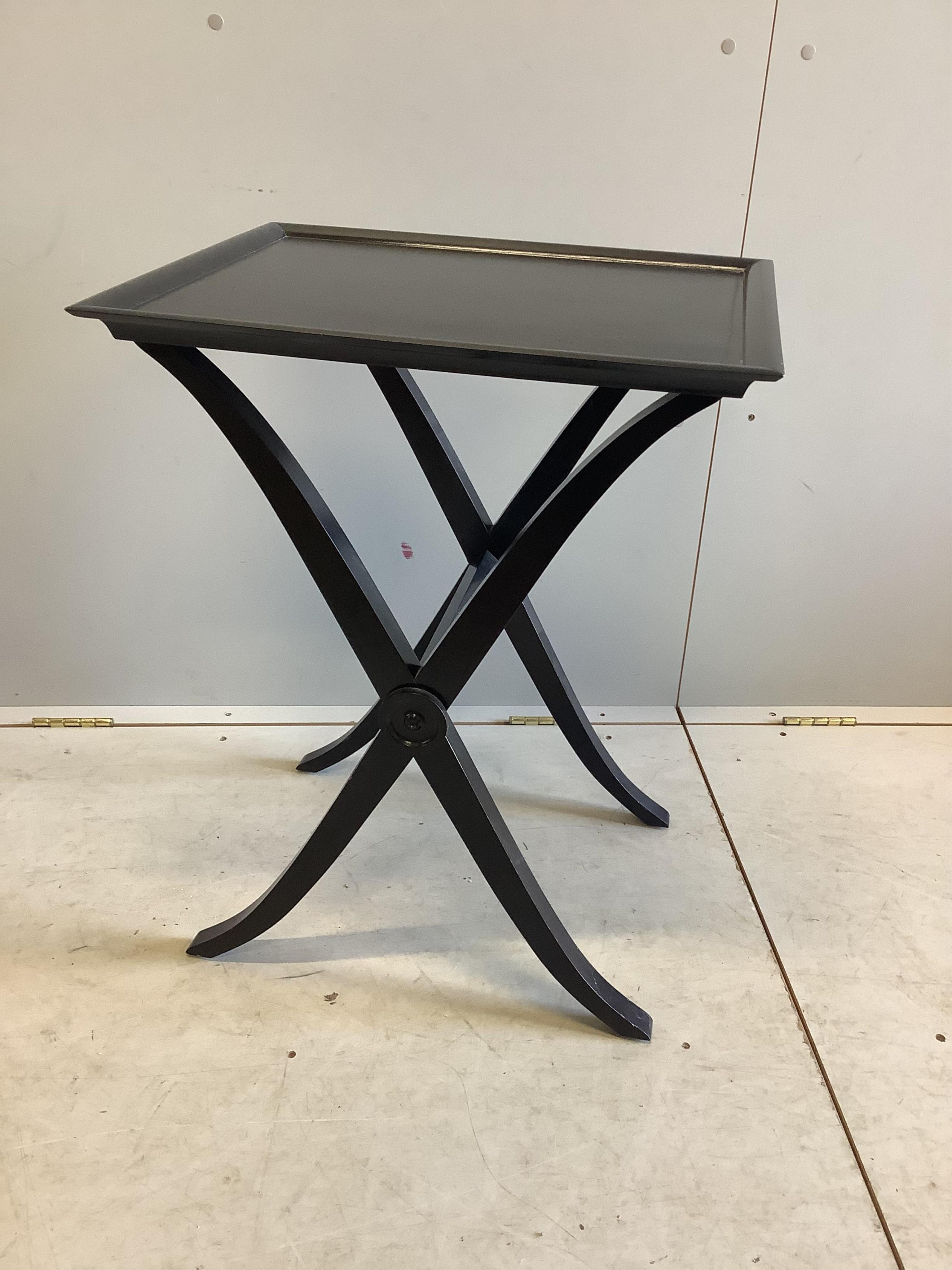 A pair of James Martin ebonised X frame lamp tables, width 55cm, depth 45cm, height 70cm. Condition - good